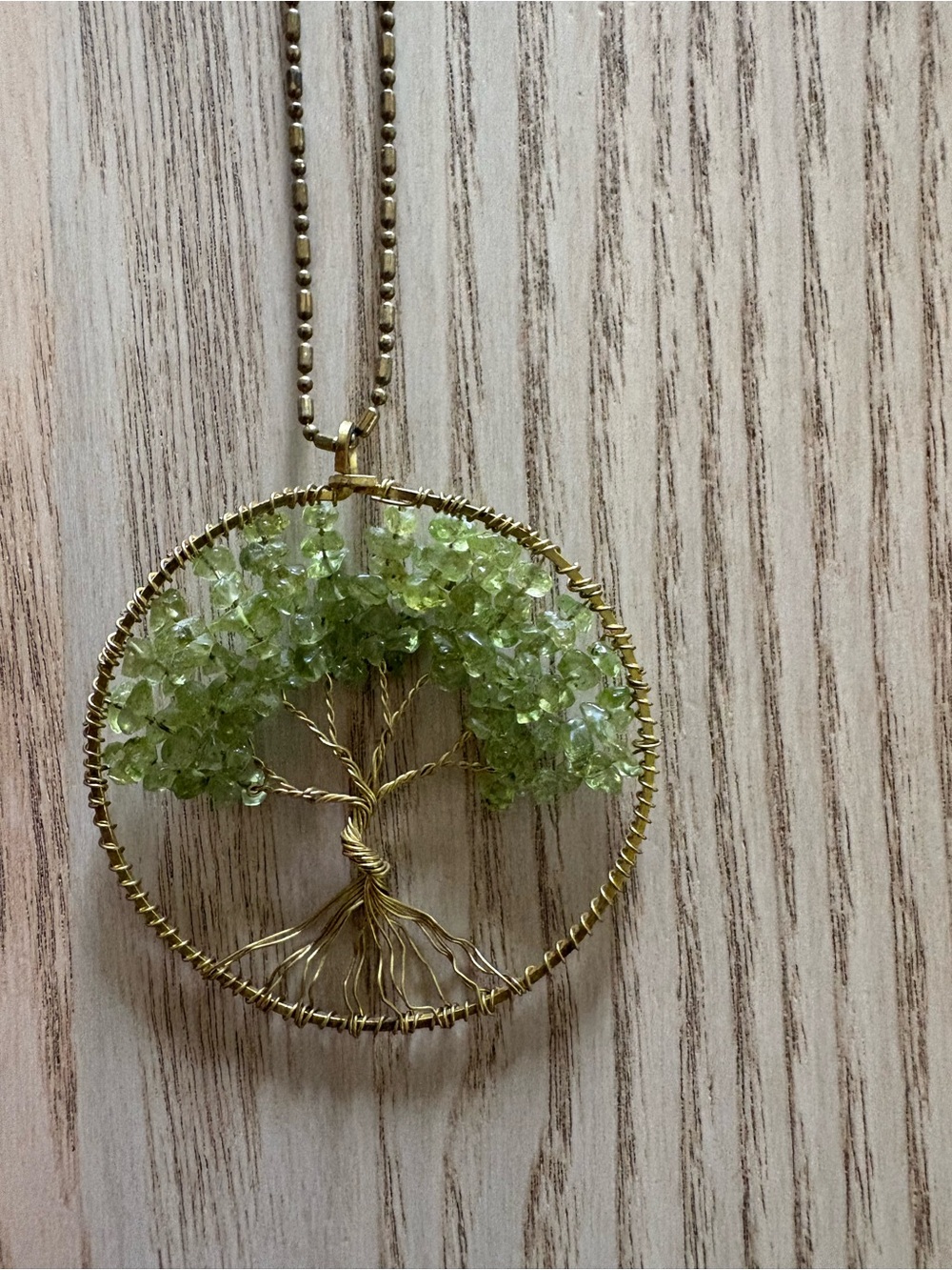 Gold Colored Tree of Life Pendant Necklace with Light Green Gem Stones